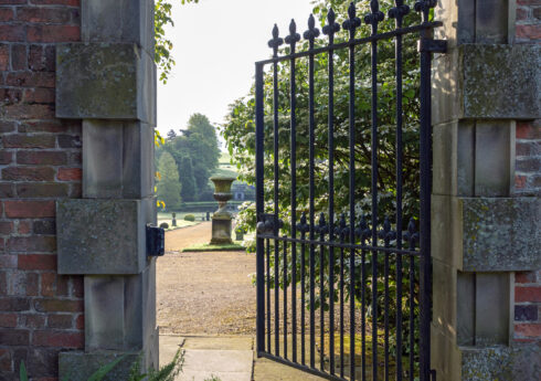 Metal gateway leading from The Coach Ring by Melbourne Hall towards the lawns leading down to The Great Basin



Photography © Andrea Jones